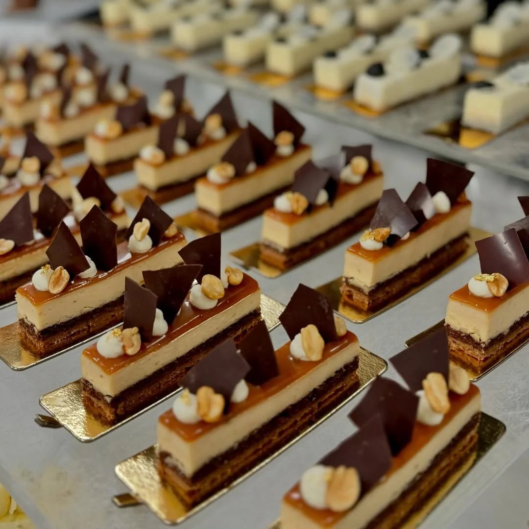 Caramel, Peanut & Cocoa Nib entremet — salted caramel mousse on hazelnut feuilletine with tempered cocoa shards